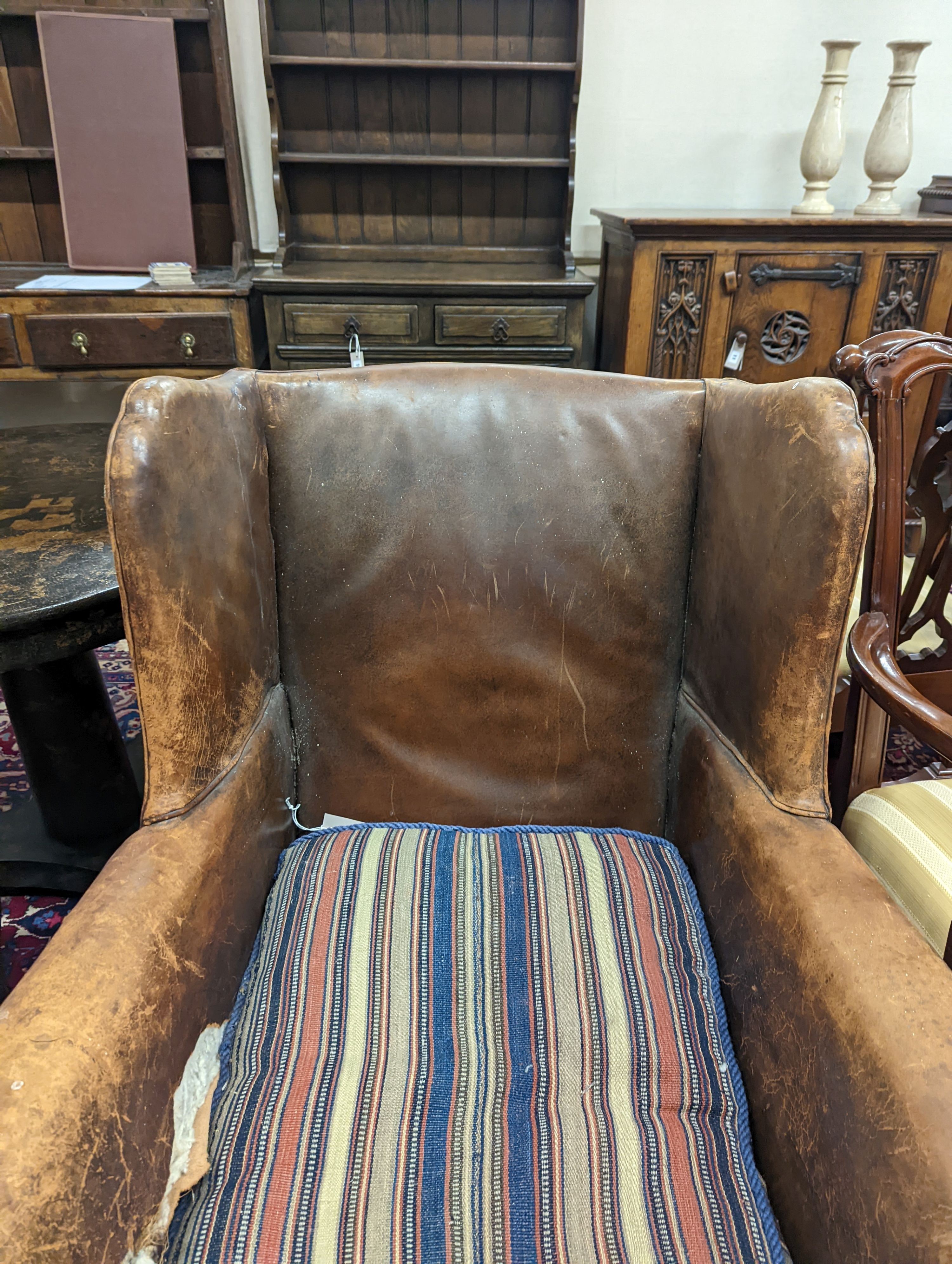 A 1940s French leather club armchair. H-91cm.